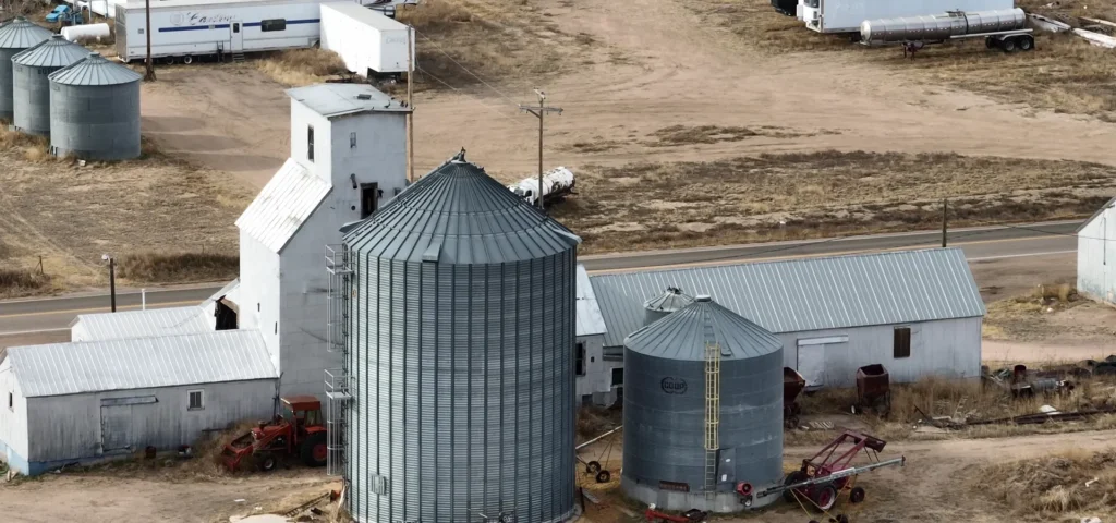 Aerial view of a grain elevator and steel grain bins